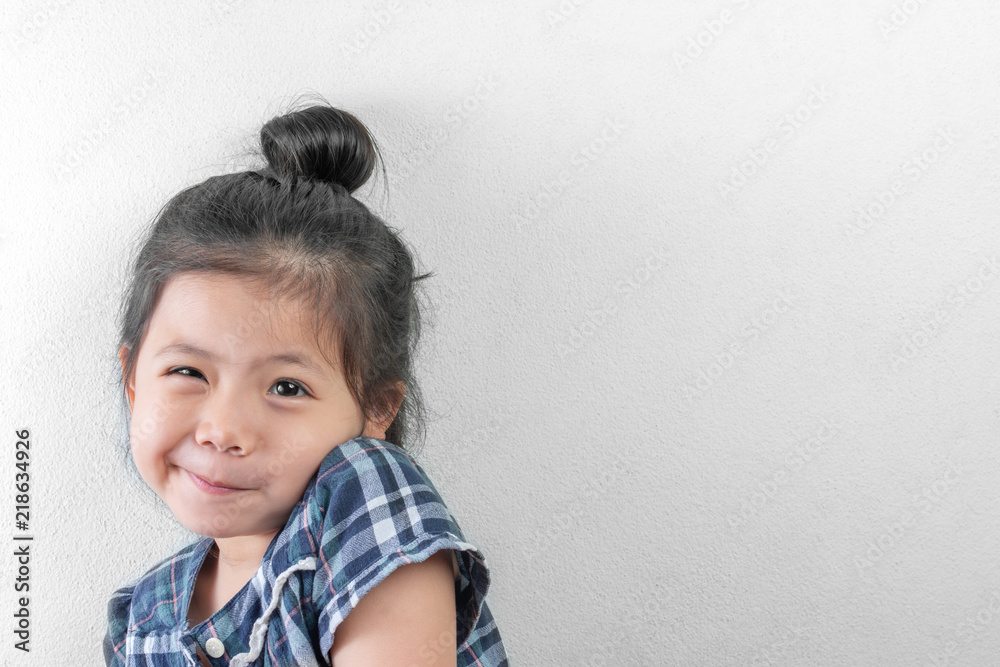 Cute Little Asian Girl smiling on White Wall background Cute Little Asian Girl smiling on White Wall background