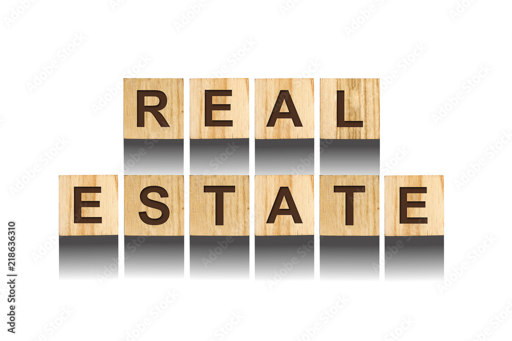 Real Estate, inscription from the alphabet on wooden cubes on a white background. Real Estate, inscription from the alphabet on wooden cubes on a white background.