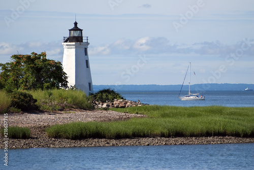 Sailboat Passing by Black Rock Harbor Lighthouse in Connecticut