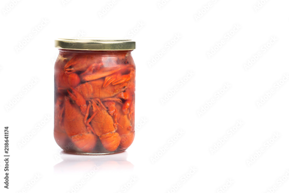 Crayfish boiled in a glass jar, on a white background. Crayfish boiled in a glass jar, on a white background.