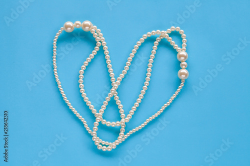 Pearl Necklace on color background.