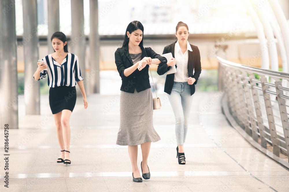Group of Business Working Woman Looking to Watches in Rush Hour - Urban Lifestyle Concept