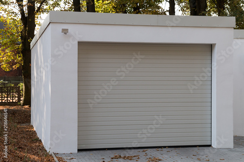 modern new white garage with roller shutter