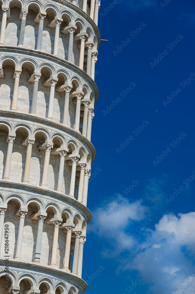 The famous Leaning Tower of Pisa monumental arches (with blue sky and copy space)