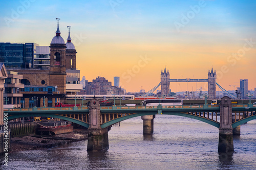 Sunset with London cityscape, Southwark bridge and Tower bridge photo