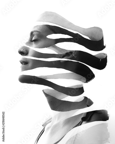 Paintography. Double Exposure portrait of a serene woman's profile combined with hand drawn ink painting, black and white