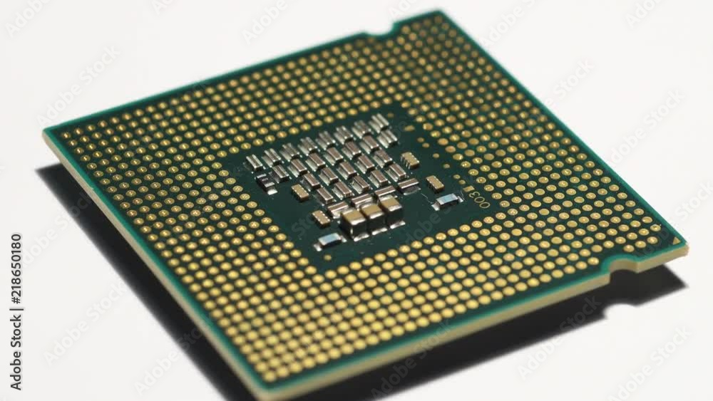 close up of computer processor rotating on white background close up of computer processor rotating on white background