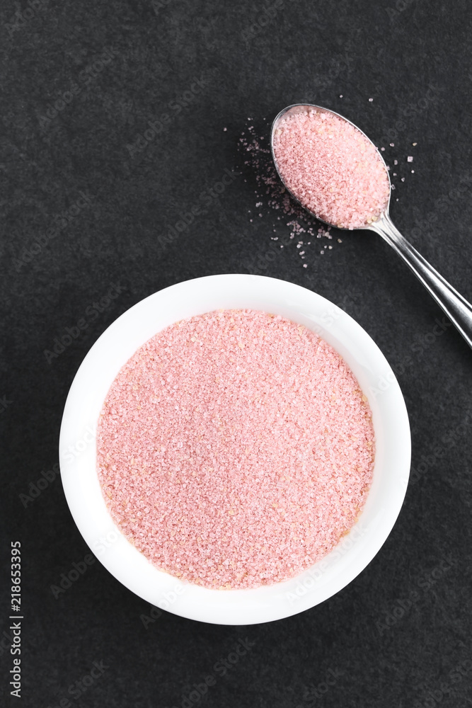 Red jelly or jello powder in small bowl and on spoon, photographed overhead  on slate (Selective Focus, Focus on the jelly powder in the bowl) Stock  Photo | Adobe Stock