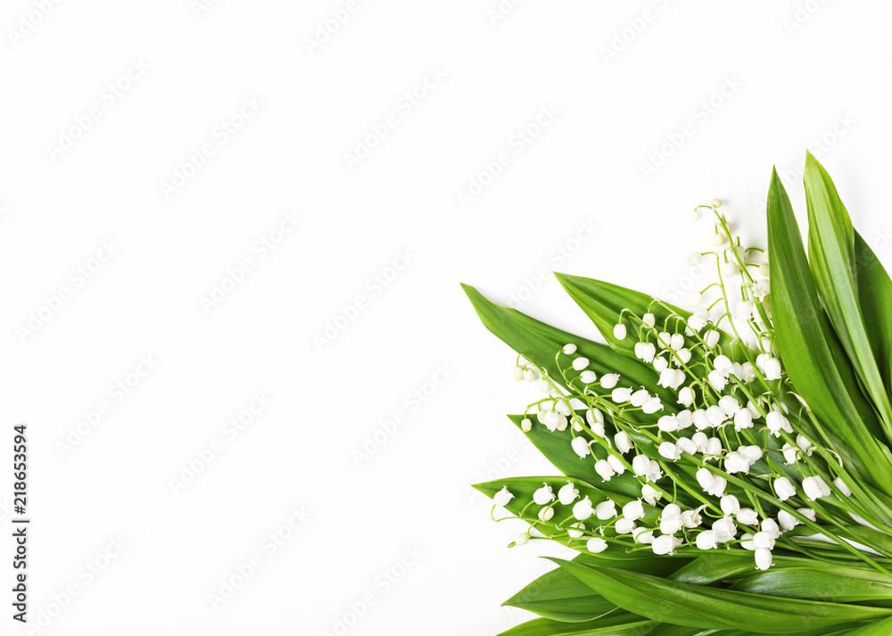 Beautiful bouquet of lilies of the valley isolated on white background. Top view with copy space. Flat lay