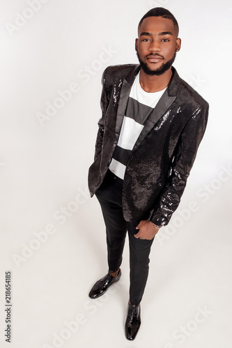 A black man in a suit. A yo...