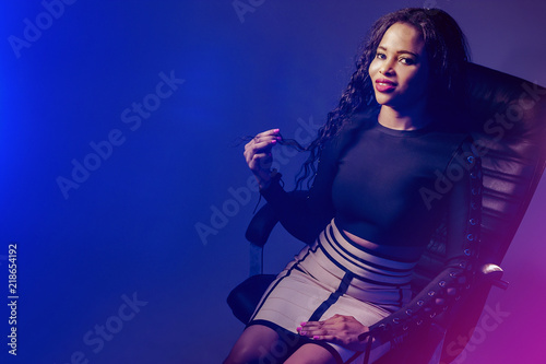 Black girl in a chair. Girl...
