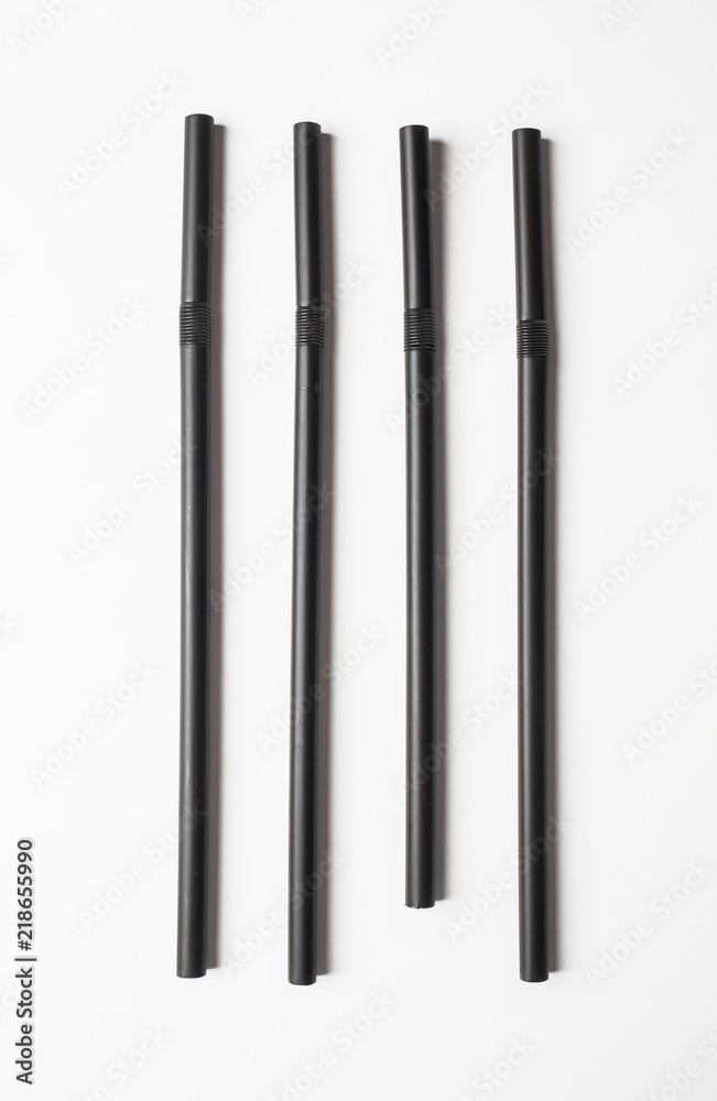 Black straws arranged in line. Concept of OCD. Black straws arranged in line. Concept of OCD.
