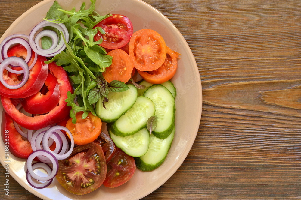 Colorful summer salad with fresh vegetables, top view, copy space Colorful summer salad with fresh vegetables, top view, copy space