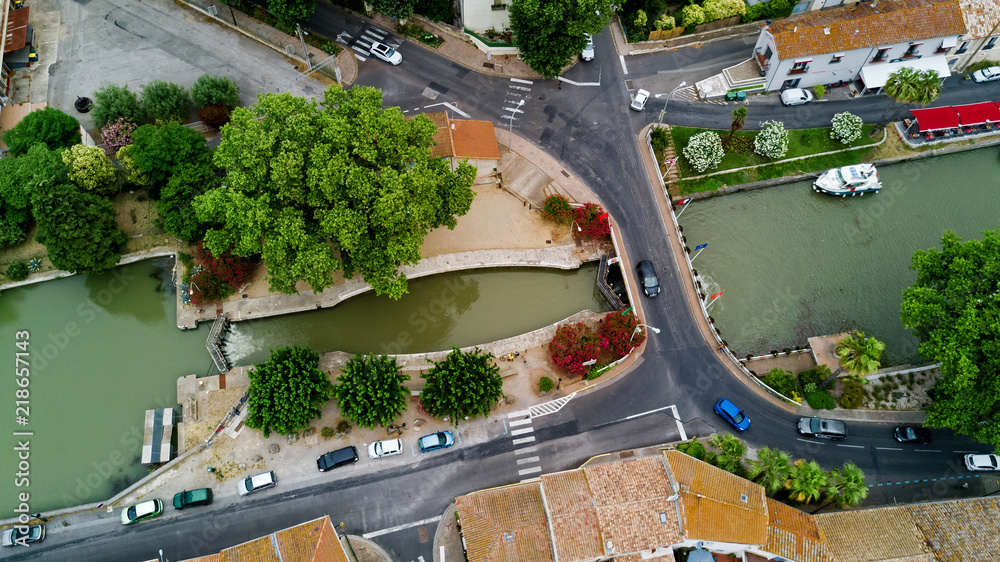 Aerial top view of boats and lock in Canal du Midi, road and bridge from above, Southern France
Aerial top view of boats and lock in Canal du Midi, road and bridge from above, Southern France