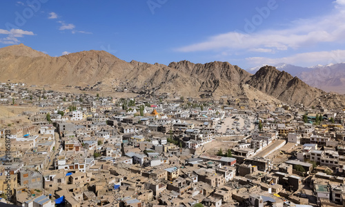 Aerial view of Leh cityscape at Ladakh India as seen from Leh Palace with panoramic view of the Himalayan mountain range.