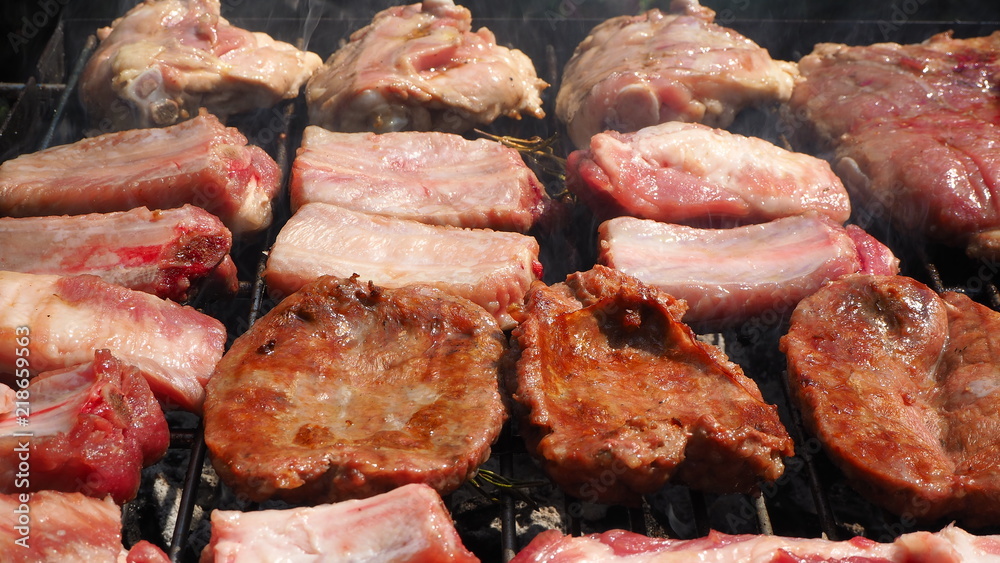 Roasted Juicy meat cooked over the coals on a barbecue Roasted Juicy meat cooked over the coals on a barbecue