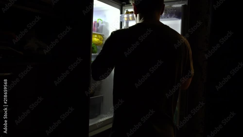 Thirsty man looking for a drink at night