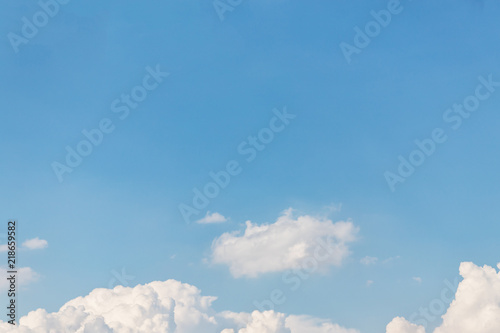 Blue sky background. Blue sky with fluffy white clouds.