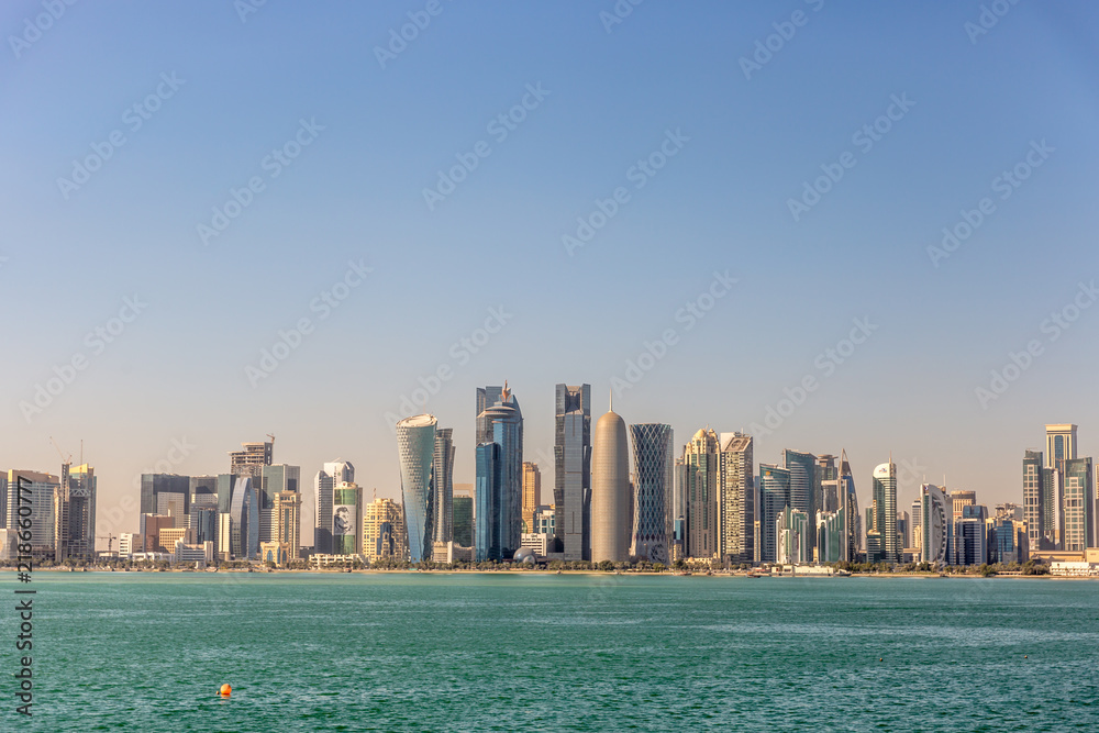 The skyline of Doha, Qatar, on a blue sky day, winter time, seen from the MIA Park