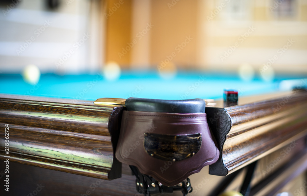 Billiard table close up. Playing billiard. Billiards balls and cue on