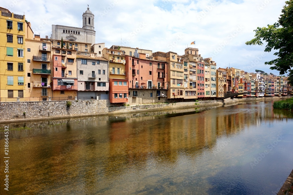 Multicolored old houses on the embankment of the river Onyar in the Catalan town of Girona