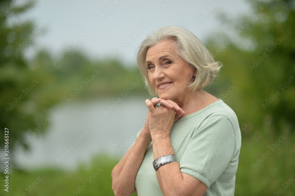 Fototapeta premium Portrait of a happy elderly woman posing