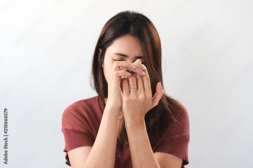 Young asian woman suffering from pain in fingertips. Young asian woman suffering from pain in fingertips.