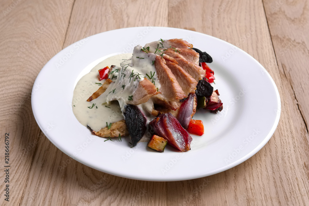 Fried meat fillet served with grilled onion, beet, pepper and zucchini Fried meat fillet served with grilled onion, beet, pepper and zucchini