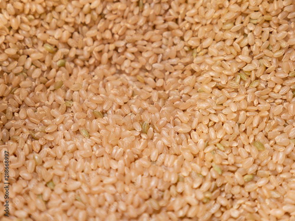 lot of brown rice texture, food background. lot of brown rice texture, food background.