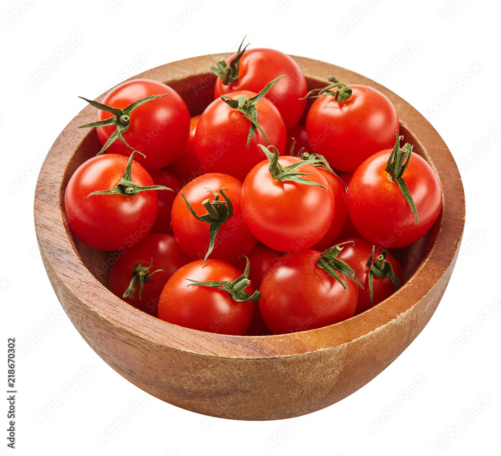 Fresh ripe tomatoes in wood bowl isolated on white background with green leaf. Ingredients for cooking. Top view. Fresh ripe tomatoes in wood bowl isolated on white background with green leaf. Ingredients for cooking. Top view.
