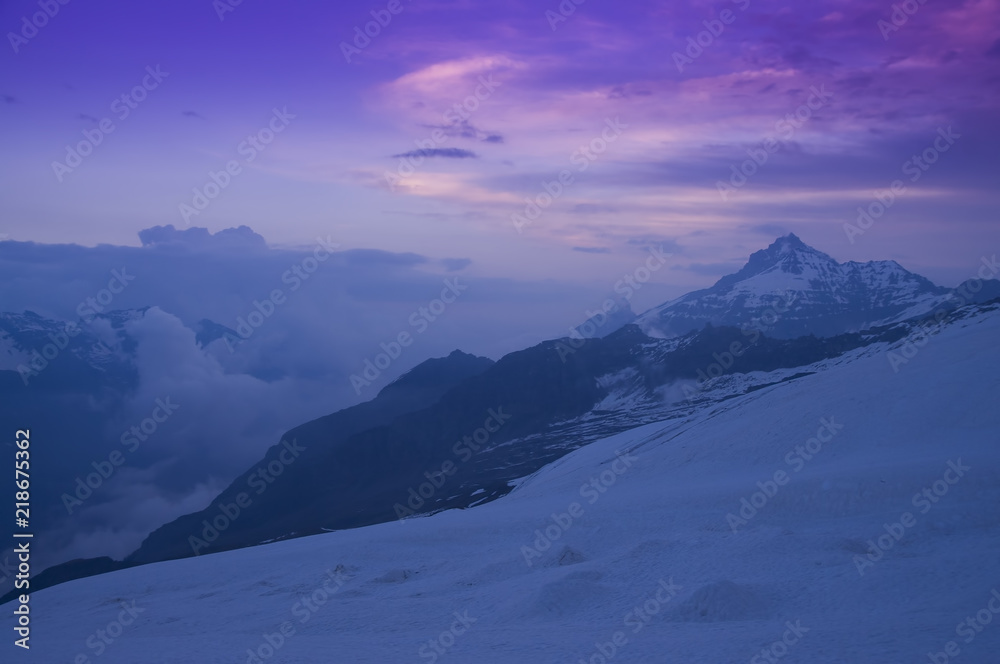 sunrise in the Alps. Grivola mountain peak seen from Gran Paradiso trail