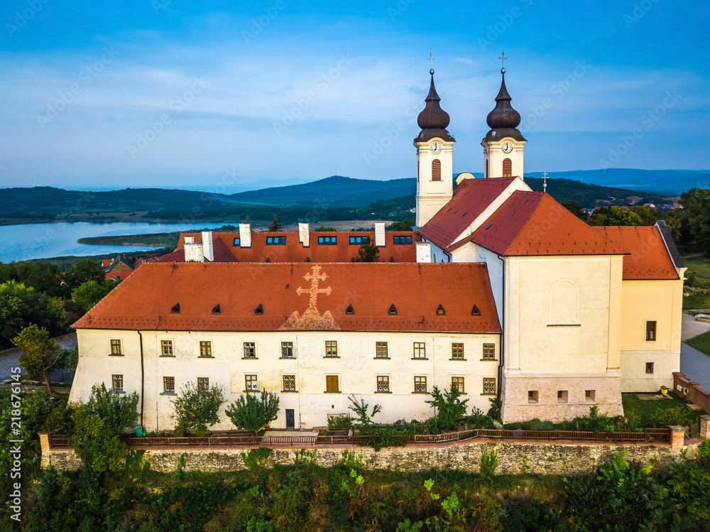 Tihany, Hungary - Aerial view of the famous Benedictine Monastery of Tihany (Tihany Abbey) at sunrise with Inner Lake (Belso-to) at background
