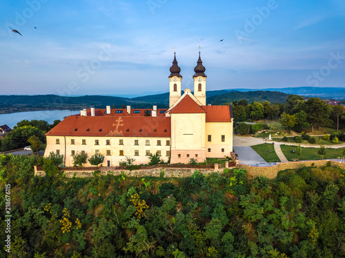 Tihany, Hungary - Aerial view of the famous Benedictine Monastery of Tihany (Tihany Abbey) at sunrise with birds in the air