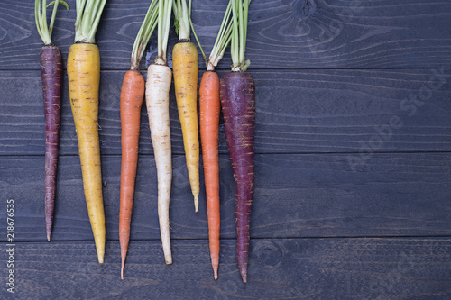 Heirloom Carrots on a wooden background