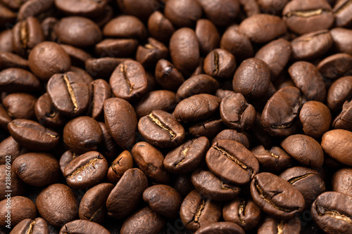 Close-up roasted coffee beans background. Top view