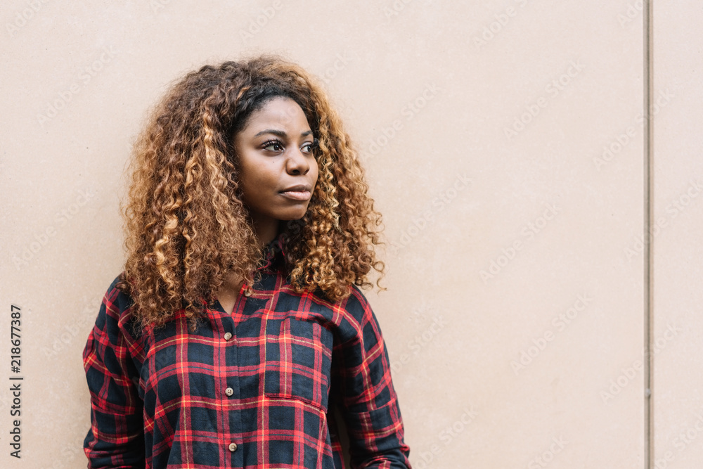 Portrait of young black woman looking away Portrait of young black woman looking away