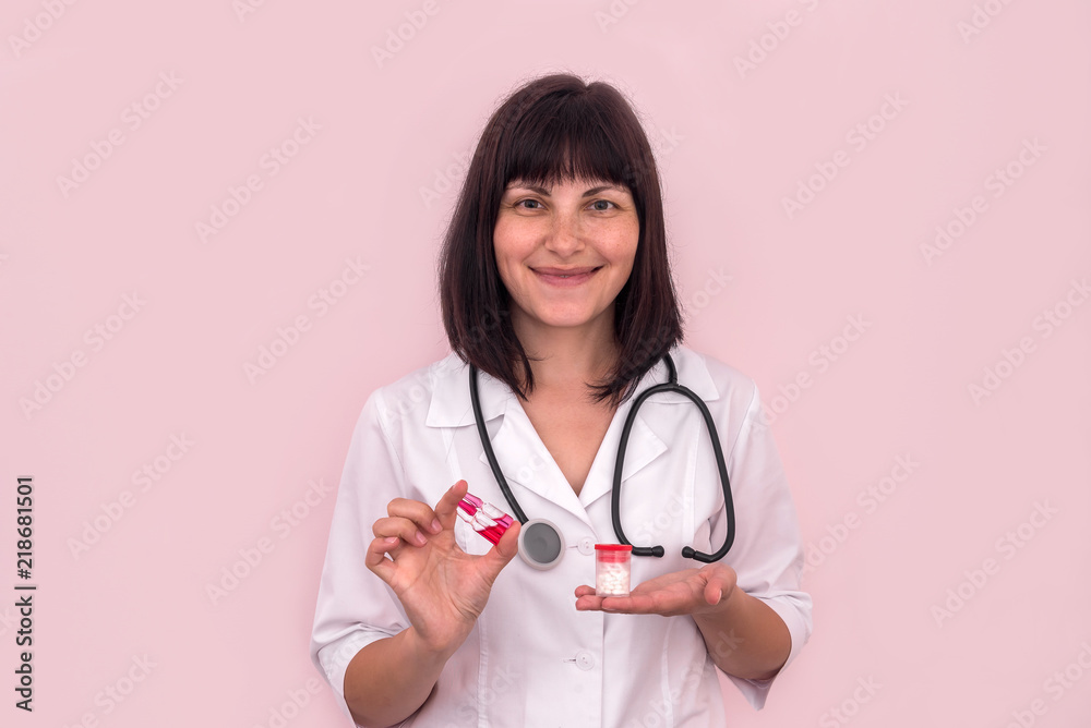 Doctor holding some tablets in container and ampoules Doctor holding some tablets in container and ampoules