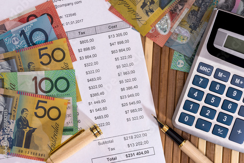 Australian dollars with purchase order and calculator photo