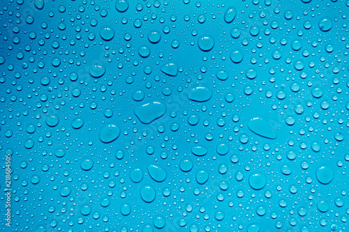 Water drops on blue background, for design and advertising