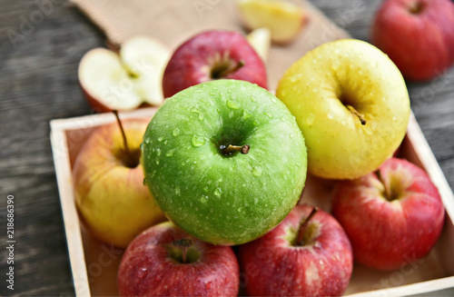 colorful of 3 Type of apple,Gala,Granny Smith,Golden Delicious in wooden box and wooden background.