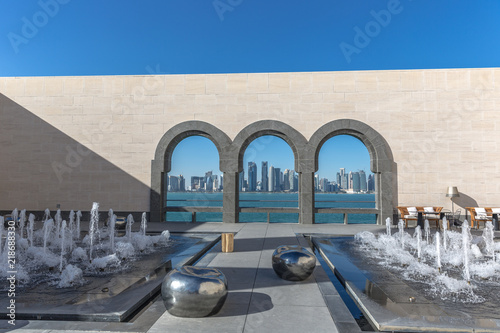 Doha, Qatar - Jan 9th 2018 - Locals and tourists enjoying a beautiful sunny day in the Museum of Islamic Arts (MIA) in the city center of Doha, Qatar photo