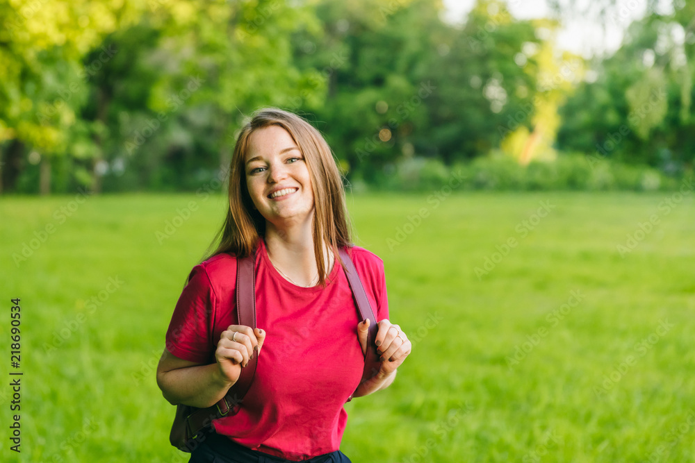Happy student girl with notes and backpack. Entering the university, starting school in September Happy student girl with notes and backpack. Entering the university, starting school in September