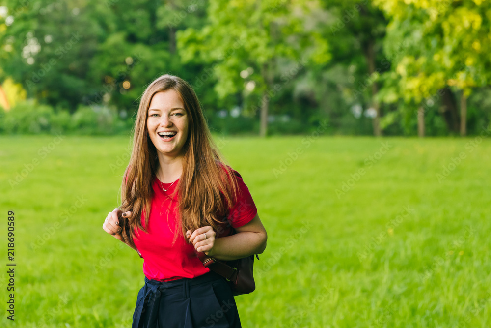 Happy student girl with notes and backpack. Entering the university, starting school in September Happy student girl with notes and backpack. Entering the university, starting school in September