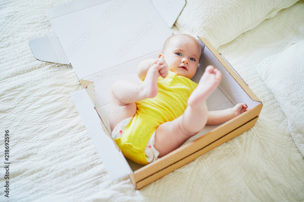 Adorable baby girl in carton box Adorable baby girl in carton box