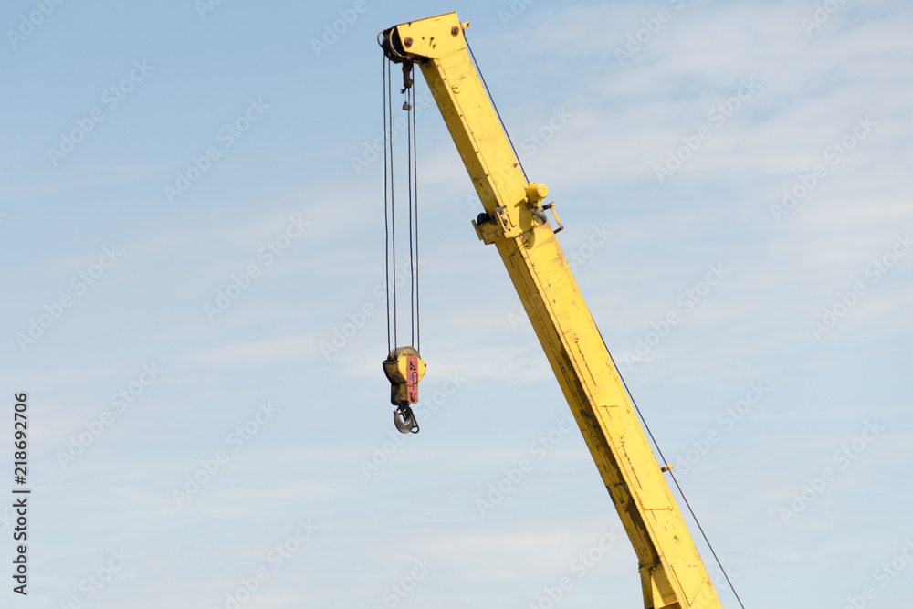Jib crane on the sky background. Place for your text. Jib crane on the sky background. Place for your text.