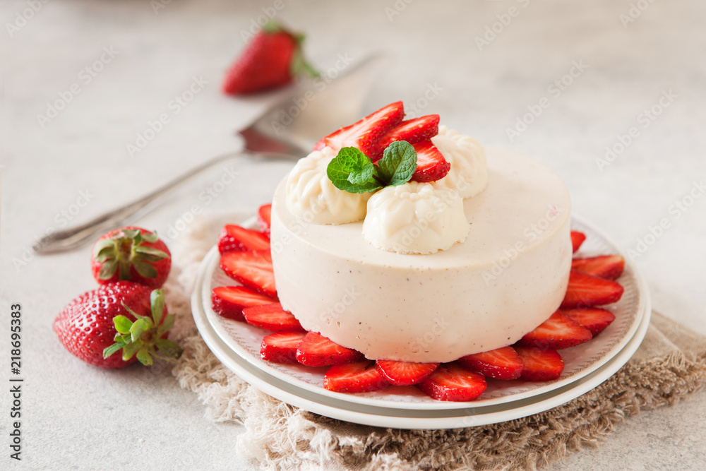 Light cheesecake with strawberry filling decorated with fresh berries and min, healthy organic summer dessert pie. Light cheesecake with strawberry filling decorated with fresh berries and min, healthy organic summer dessert pie.