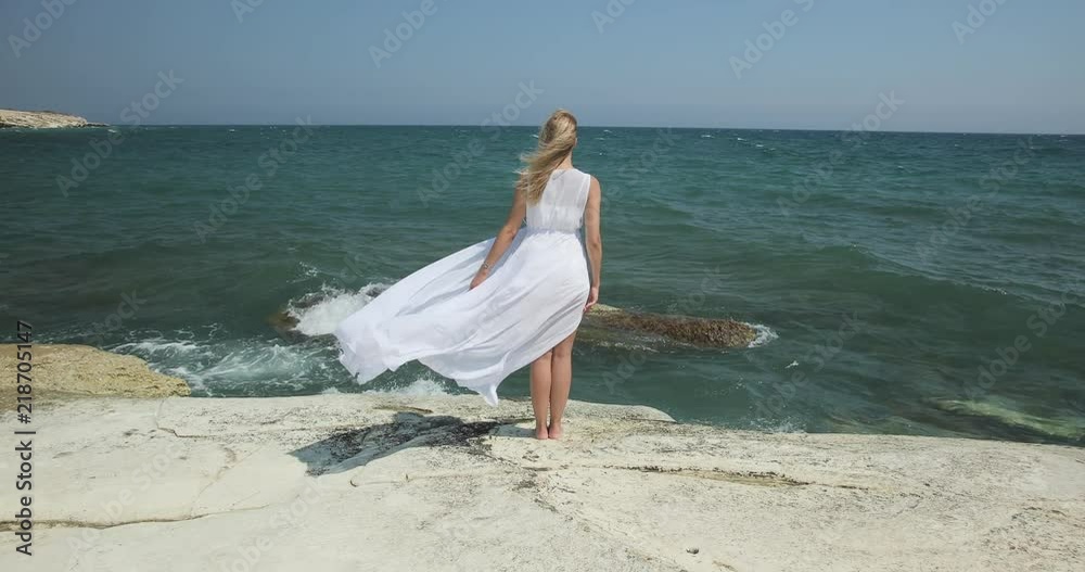 Woman standing near sea Woman standing near sea