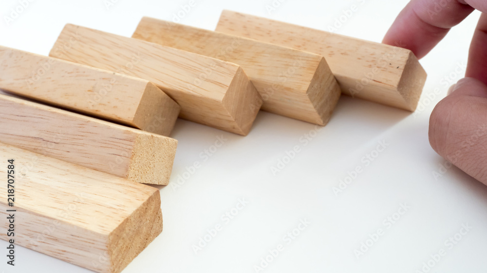 wooden block with hand on white background wooden block with hand on white background