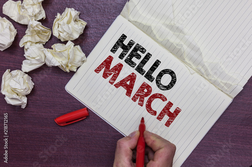 Handwriting text Hello March. Concept meaning musical composition usually in duple or quadruple with beat Man holding marker notebook page crumpled papers several tries mistakes. photo