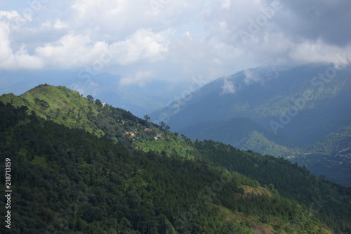 mountain landscape with cloud sky and valley natural forest in monsoon season © aneeshrathi